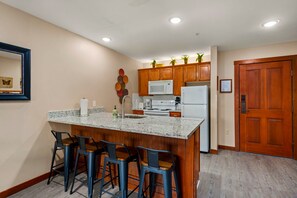 Our modern kitchen features a beautiful island with bar stools.