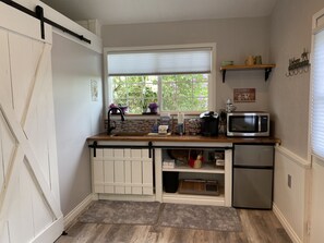 Little kitchenette. Microwave, Keurig and assorted coffees and teas, fridge.