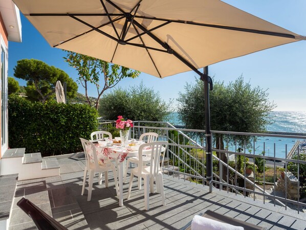 Property, Plant, Furniture, Sky, Water, Table, Tree, Chair, Shade, Outdoor Furniture