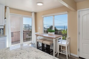 Eat-in kitchen dining area seats 4 with ocean views for morning coffee