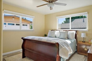 Queen sleigh bed in the master with natural light - feels very roomy