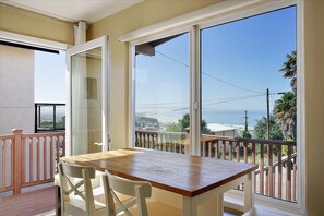 Lots of natural light all day from the giant front windows and doors to deck