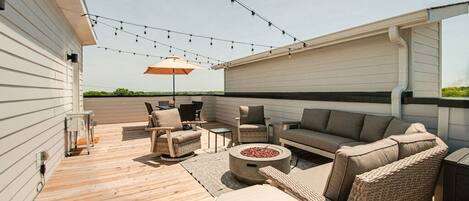 Enjoy a sunrise or sunset on the private rooftop patio with plenty of seating.