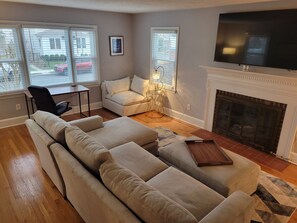 Living Room with 65in Smart TV and sectional