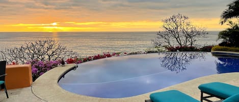 Infinity-edge pool at sunset.  Enjoy sunset views 365 days per year.