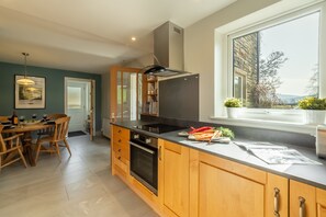 1 Riverside Cottages, Burnsall: Well-equipped kitchen leading to dining area