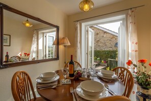 Fox Cottage, Middleham: Dining room and french doors leading to the garden