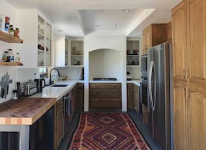 Fully equipped kitchen with stove, oven, microwave and garbage disposal.