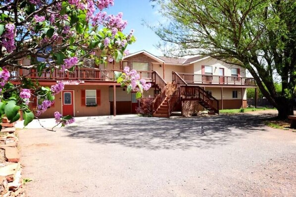 Front of house. Ample parking. Dwelling #1 is located on ground floor on the left side of photo.