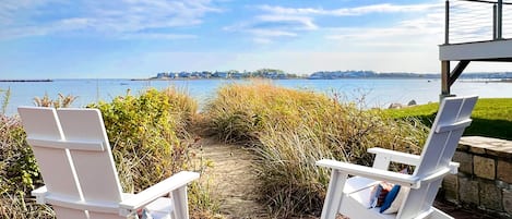 Year round seating looking into sandy path to the beach in November.