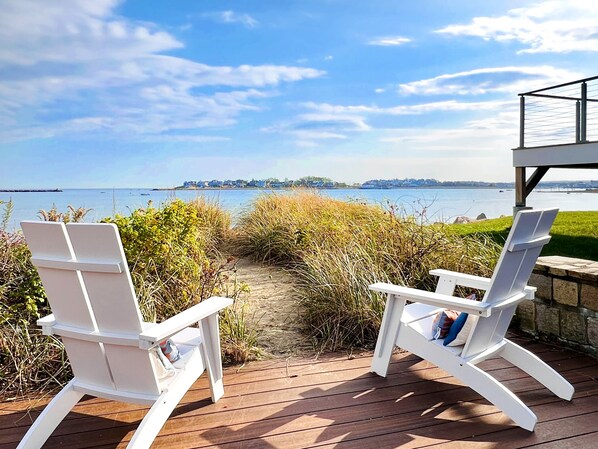 Year round seating looking into sandy path to the beach in November.