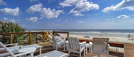 Large deck leading to a quiet car-fee beach.