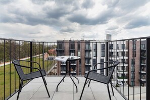 The balcony provides a tranquil spot for enjoying a book. 
