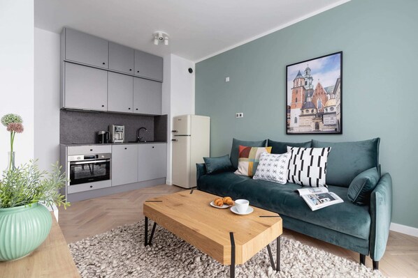 Relax in the stylish living room with a comfortable sofa and modern decor.