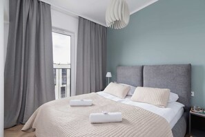 Enjoy the simplicity and comfort of the bedroom's modern design. 