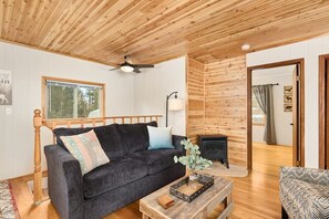 Upstairs living room with wood burning fireplace.
