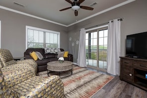 Living room w/ access to Private Deck