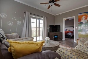 Living Room w/ access to private deck