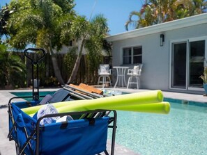 Wagon, beach chairs, beach bag, cooler bag, pool noodles, pool floats and beach towels provided.