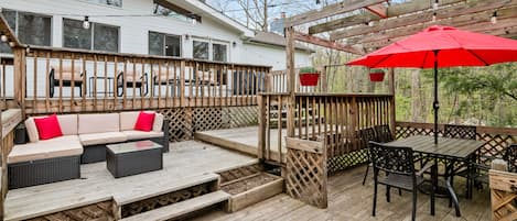 Relax on the back porch with 3 tiers of seating for 14 people with our 3.5 acres