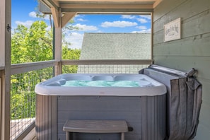 Unwind and rejuvenate in our private deck hot tub, the perfect oasis for soothing your cares away