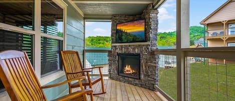 Relax and unwind with the charm of our porch fireplace, perfect for relaxing in front of after soaking in the hot tub.