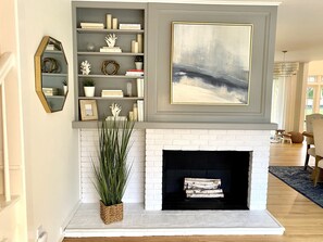 Beautiful entryway with non-working fireplace