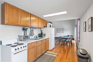 Kitchen with all the dishware and utensils you will need to cook a meal. 