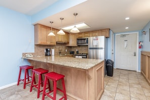 Well-equipped kitchen with bar seating