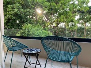 Private balcony overlooking scenic greenery