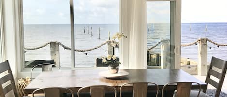 Dining area overlooking private beachfront