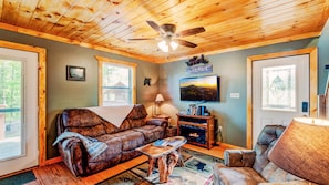 Step into our cozy living room where you can watch your favorite movie.