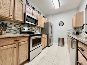 Kitchen with Granite & New Stainless Steel Appliances 
