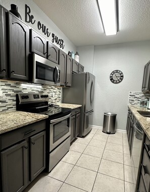 Kitchen with Granite & Stainless Steel Appliances.