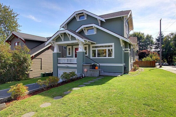 Driveway provides off-street parking and a large lawn provides plenty of outdoor space for kids of all ages to play. There are chairs and a table for hanging out on the front porch as well.