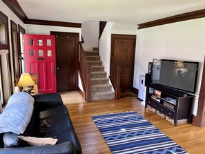 Stairs from living room lead to upstairs bedrooms