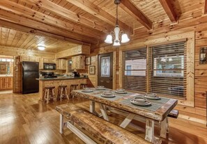 Live edge dining room table with bench seating.