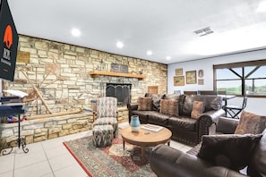 Gorgeous oversized stone fireplace in the heart of the home