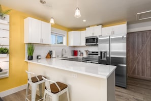 Well stocked kitchen with Samsung appliances and quality cookware