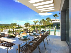 Table, Sky, Furniture, Daytime, Property, Plant, Azure, Chair, Shade, Building