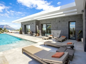 Cloud, Sky, Property, Water, Building, Shade, Swimming Pool, Window, Table, Outdoor Furniture