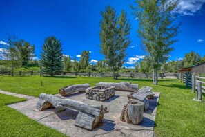 Stone Fire Pit and Log Benches