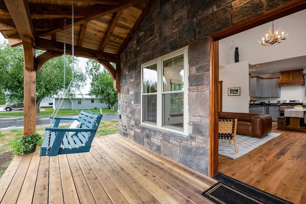 Enjoy the peace and beauty from the front porch swing.