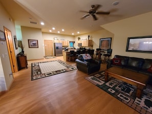 Panoramic view of open plan living room and kitchen.