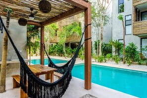 Hammocks and tables and TWO pools!