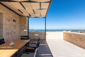 The balcony is equipped with patio furniture and amazing views.