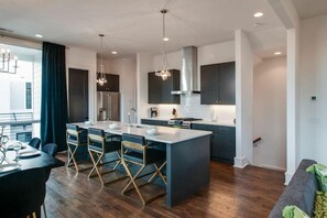 Custom kitchen with Island seating and high end appliances