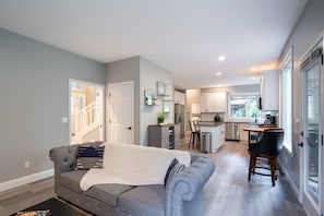 Open living space next to kitchen and island