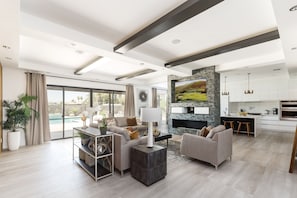 Bright Contemporary Living Room featuring a flat-screen SMART TV and designer furnishings.