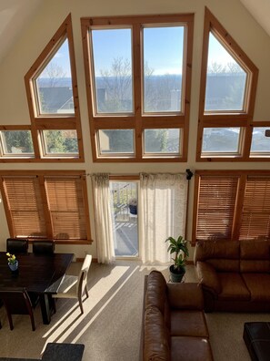 High ceiling open concept living, dining and kitchen area.